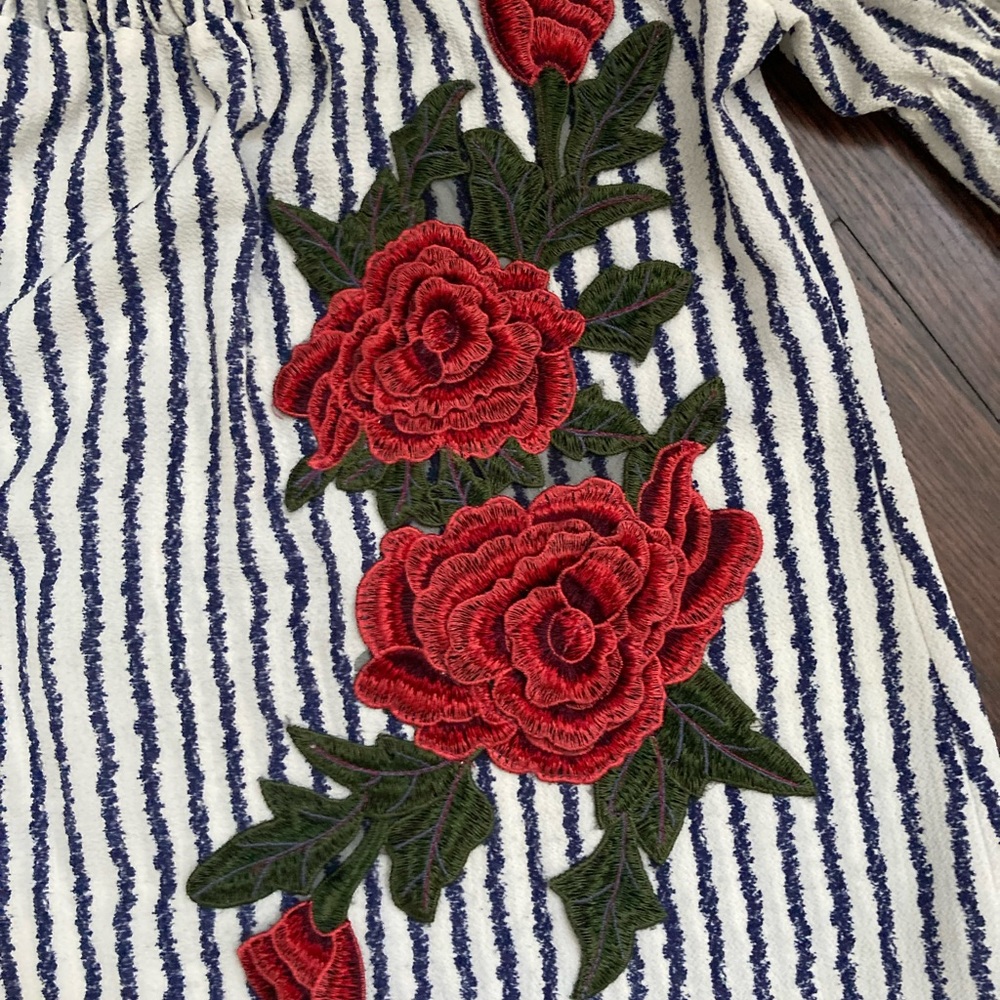 Beautiful top with 3-D flower.